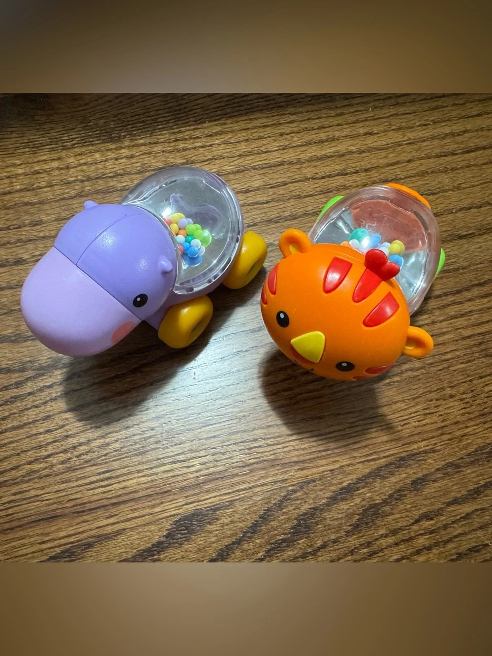 Lot of 2 Fisher Price Purple Hippo and Orange Lion Baby Rattle Set